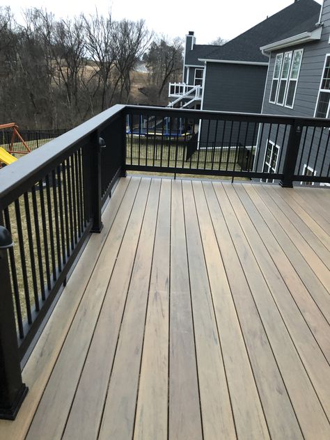 Timber tech tigerwood with espresso border and builder rail. Natural Wood Deck With Black Railing, Trek Patio Ideas, Timber Tech Tigerwood Deck, Timber Tech Deck Railings, Tigerwood Timbertech Decking, Deck Stain With Black Railing, White House Black Deck, Trek Deck Colors, Timbertech Tigerwood Deck