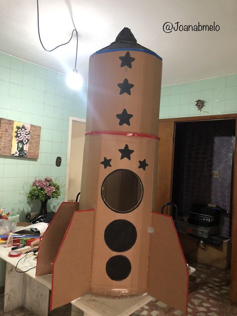 Paper Mache Rocket Ship, Rocket Ship Craft Cardboard Boxes, Diy Rocket Ship Cardboard, Cardboard Rocket Ship Diy, Vbs Stellar, Rocket Project, Cardboard Spaceship, Space Vbs, Rocket Decorations