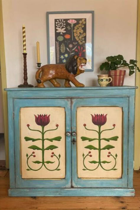 Embrace bohemian charm with this vintage hand-painted floral chest of drawers. The rustic blue frame beautifully complements the intricate folk art floral designs, creating a unique and eye-catching piece perfect for adding character to any room. With its whimsical style and practical storage, this chest is an ideal addition to eclectic or cottage-inspired decor. Shop now on Vinterior. Blue Cupboard, Hand Painted Dressers, Room Measurements, Folk Art Floral, Folk Decor, Painted Cupboards, Painted Drawers, Whimsical Style, Interior Colour