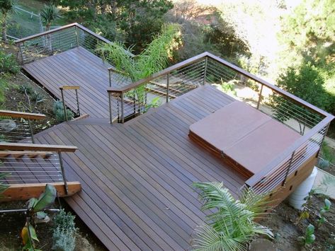 Two Story Backyard Deck Ideas With Bult In Hot Tub Area Hillside Deck, Backyard Deck Ideas, Composite Decking Designs, Tiered Deck, Laying Decking, Sloped Backyard, Deck Installation, Wooden Deck, Hillside Landscaping