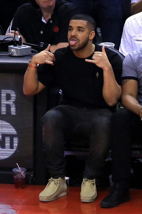 Drake wearing Ovo Pom Pom Crewneck and Clarks Suede Wallabee Boots in Maple Clark’s Outfits Men, Clarks Wallabees Men Outfit Mens Fashion, Clarks Men Outfit, Clarks Shoes Outfit, Clark Wallabees Men Outfit, Clarks Wallabees Men Outfit, Clark Wallabees Outfit, Wallabees Outfit Men, Drake Fits