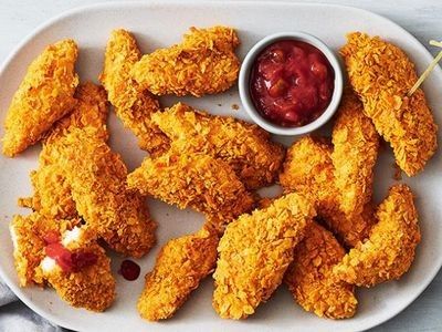 Nacho Cheese Doritos make these golden chicken tenders extra crunchy. Doritos Chicken Tenders, Dorito Crusted Chicken Tenders, Captain Crunch Chicken Tenders, Coconut Crusted Chicken Tenders, Chicken Tenders With Panko Bread Crumbs, Homemade Sausage Rolls, Chicken Kiev, Chicken Nachos, Chicken Tenderloins