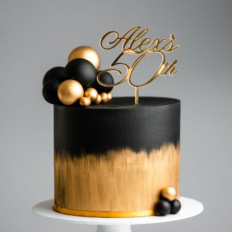 Brushed Gold and Black Sphere Cake Tutorial | buttercream, cake, ganache, icing, chocolate | Our cake decorating courses: https://vimeo.com/rosiesdessertspot/vod_pages And another black and gold cake coming your way! This one features a brushed... | By Rosie's Dessert Spot Golden Cake Design For Men, Black And Gold Engagement Cake, Black And Gold 80th Birthday Cake, Black Ganache Cake, Black And Gold 2 Tier Cake, Black And Gold Tiered Cake, Simple Black And Gold Cake, Black And Gold Birthday Cake For Him, White Black And Gold Cake