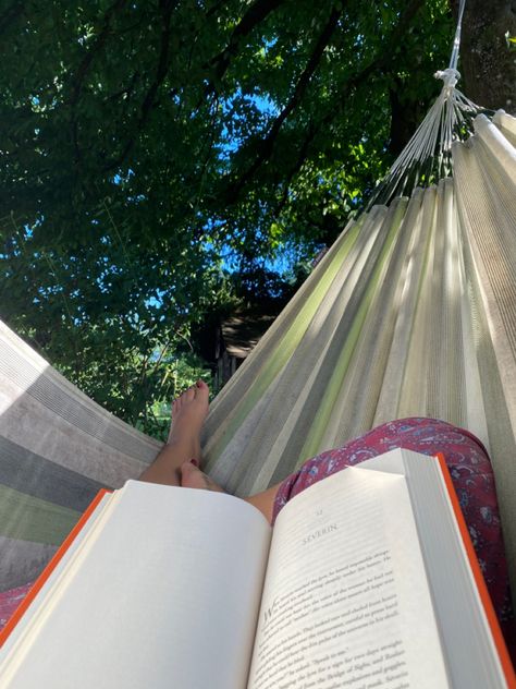 A book on legs in a green hammock Reading Hammock Aesthetic, Summer Hammock Aesthetic, Hammock Reading Aesthetic, Reading In A Hammock, The Bronzed Beasts, Reading In Hammock, Reading Hammock, End Of Summer Aesthetic, Hammock Aesthetic