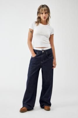 90s-inspired ultra-baggy jeans by BDG. In a dark rinse denim with a relaxed fit and exaggerated detailing. Cut to a low waist, belt loops, button and zip closure and a signature five-pocket silhouette. Only at UO. **About Better Cotton** \- By choosing our cotton products, you’re supporting our investment in Better Cotton’s mission \- This product is sourced via a system of mass balance and therefore may not contain Better Cotton \- Bettercotton. org/massbalance **Content + Care** \- 100% Cotton Low Waist Belt, Dark Blue Jeans, 90s Inspired, Low Waist, Girls Jeans, Baggy Jeans, Waist Belt, Blue Jeans, Investment