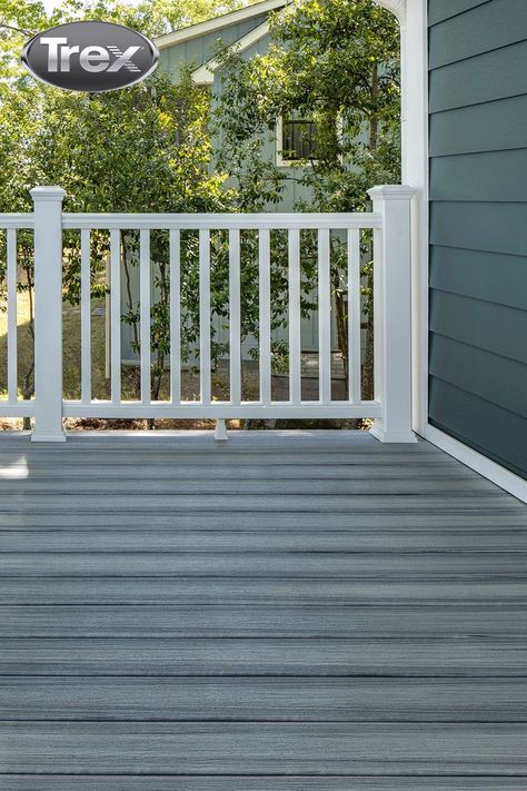 No matter the size of your patio space, you can zhuzz it up with the right brands and items. It’s why Trex® offers everything homeowners need, from composite decking to railing, outdoor furniture and more. Pictured here, Trex Enhance® Naturals decking in Foggy Wharf is complemented by Trex Transcend® Railing in Classic White. The cozy nook is made possible by Trex Outdoor Furniture™. The possibilities don’t end there, click the link for more inspiration. Ideas For Small Patios, Trex Transcend Railing, Railing Outdoor, Trex Enhance, Porch Railing Designs, Ground Level Deck, Small Patios, Trex Transcend, Deck Pictures