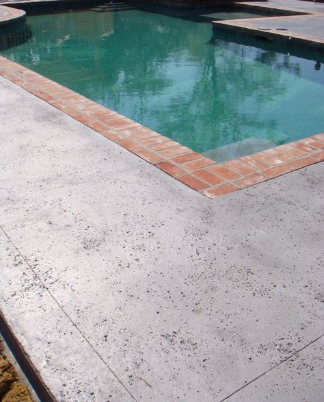 Stamped concrete with salt rock texture by Nu-Crete Concrete Deck Ideas, Painted Pool Deck, Swimming Pool Cost, Concrete Pool Deck, Stamped Concrete Driveway, Diy Patio Pavers, Building Hacks, Salt Rock, Patio Pavers Design