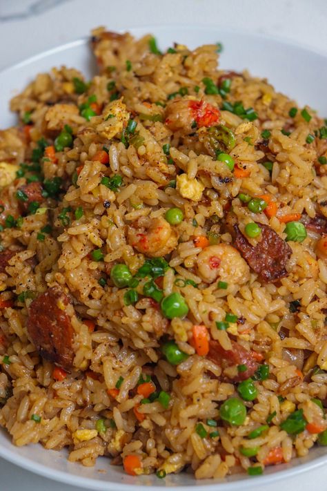 Culinary+Fusion:+The+Bold+Flavors+of+Cajun+Fried+Rice Creole Fried Rice, Cajun Shrimp Fried Rice Recipe, Crawfish Fried Rice, Cajun Fried Rice, Cajun Rice Recipe, Salmon Fried Rice, Seafood Fried Rice, Rice Meals, Cajun Fries