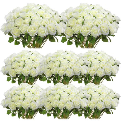 PRICES MAY VARY. Lifelike Artistry: you will receive 80 lifelike silk roses; Made from silk cloth, these wedding artificial roses mimic the realistic details and charm of a fresh rose; Their natural white hue is not only robust but also captivating, making them the ideal adornments for your life's magical moments Ideal Size and Reliable: these faux roses with stems come in a suitable size of about 19.7 inches/ 50 cm; Beautiful and designed with a rich, vibrant white color, these artificial bouqu Rose Buket, Silk Rose Bouquet, Wedding Party Centerpieces, Fake Roses, Centerpieces Party, Party Table Centerpieces, Realistic Rose, Roses Bouquet, Hari Valentine