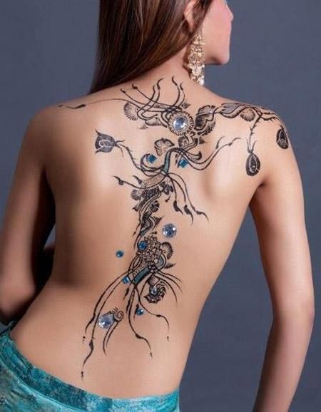 As long as those are not real gems this would be cool. If they are that would just be painful. Woman With Tattoos, Jewel Tattoo, Tato Henna, Girl Back Tattoos, Tattoo Henna, Cool Tattoo, Design Henna, Full Back Tattoos, Body Tattoo