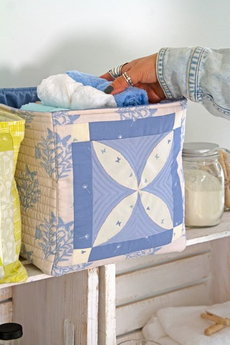 Transform your laundry room with these quilted baskets! Featuring prints from Fresh Linen by Katie O'Shea. Find sewing inspiration in our Fresh Linen lookbook! #SewingInspiration #LaundryRoomDecor #AGFFreshLinen #ArtGalleryFabrics #DIYBaskets #PastelColors #QuiltingCotton  #DIYHomeDecor #FabricCrafts #DIYProjects #Sewing #SewingInspiration #SmallSewingProjects #OrganizingBaskets #SpringCrafts #CraftIdeas #Patchwork #TextileCrafts Sew Fabric Storage Baskets, Diy Quilted Basket, Free Pattern Fabric Bins, Laundry Basket Quilt Kits, Quilted Baskets, Quilted Boxes Fabric Basket, Square Fabric Basket Pattern, Quilted Basket, Basket Sewing Pattern