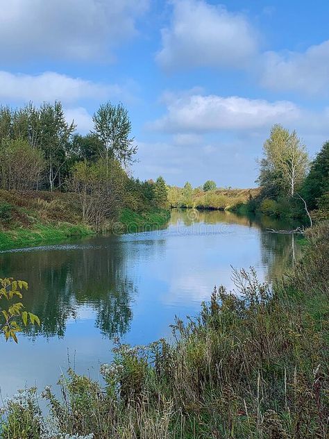 Nature by the river, bushes and trees on the banks of the flowing river, spring, a place for canoeing royalty free stock photography Flowing River, Vector Technology, River Landscape, Canoeing, Stock Photography Free, The River, Banks, Stock Photography, A Place