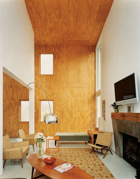 A double-height living area clad in unfinished plywood, in Connecticut. (Photo… Ply Wood Wall Ideas, Plywood Fireplace, Plywood Living Room, Plywood Interior Design, Plywood Interior Walls, Plywood Accent Wall, Plywood Bedroom, Plywood Room, Plywood Wall Paneling