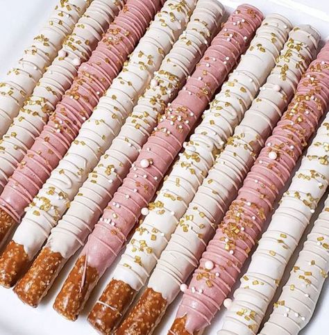 Strawberry Dipped Pretzels, Chocolate Strawberries And Pretzels, Pretzel Sticks Dipped In Chocolate Pink, Pretzel Dip In Chocolate, Pretzel Rods Dipped Wedding, Pink White And Gold Chocolate Covered Pretzels, Pretzel Stick Dessert, Pink And Gold Chocolate Covered Pretzels, Pink Chocolate Dipped Pretzels