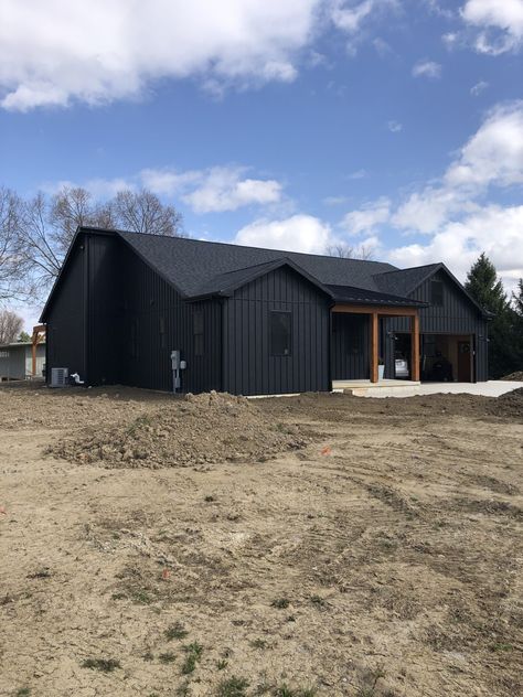 Photo Gallery of Our Finished Projects | Metal Exteriors Black Steel House Exterior, Black Steel Roof House, Black Board And Batten House, Metal Batten Siding, Black Metal Board And Batten Siding, Black House With Black Metal Roof, Black House Metal Roof, Metal Siding Cabin, Standing Seam Metal Siding