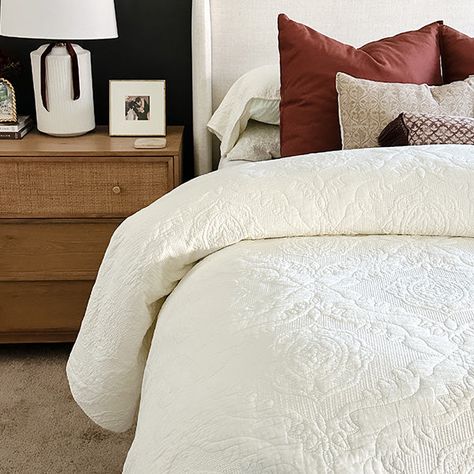 Indulge in restful slumber with our soothing Ivory Cotton Lightweight Bedspread Set, designed for dream-filled nights.At first glance, the bedspread exudes clean simplicity in a serene ivory shade, offering a peaceful and tranquil ambiance to your bedroom. However, a closer look reveals the reversible intricate and ornate damask embroidered patterns that adorn the quilt, transforming it into an elegant Victorian masterpiece.The solid, neutral ivory or off-white color effortlessly complements a w White Quilt Bedding, Beach House Decor Living Room, Cream Quilt, Ivory Bedding, Porch Styles, Shelf Baskets Storage, Cotton Quilt Set, Embroidered Patterns, White Quilts