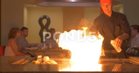 Hibachi Chef Lighting Fire While Cooking, Friends at Asian Restaurant Stock Footage #AD ,#Fire#Cooking#Lighting#Hibachi Hibachi Chef, Cooking Friends, Asian Restaurant, Asian Restaurants, Fire Cooking, Cooking Light, Merchandise Design, Stock Video, Stock Footage