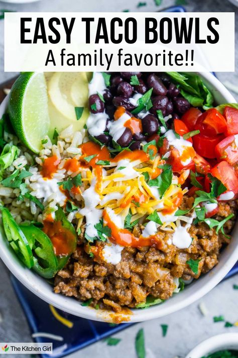 Taco bowl with taco meat, tomatoes, black beans, rice, cheese, sour cream, avocado, and lime. Title: Easy Taco Bowls: A Family Favorite!! Taco Meat Lunch Ideas, Healthy Taco Night, Meals In A Bowl Recipes, Healthy Taco Bowl Meal Prep, Chicken Taco Bowls Healthy, Mexican Bowl Recipe Healthy, Taco Bowls Ground Beef, High Protein Taco Bowl, Ground Beef Taco Bowls