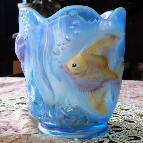 This Rare And Unique Fenton Vase Showcases A Colorful Atlantis Sea Pattern With Hand-Painted Koi Fish On Opalescent Glass. The Vase Features A Beautiful Blue Color, Adding To Its Charm And Making It A Great Addition To Any Collection. The Vase Is Signed By The Artist, Further Highlighting Its Authenticity And Uniqueness. Made From High-Quality Glass, This Vintage Original Vase Exudes An Art Glass Production Style That Is Perfect For Decorative Pottery And Glassware Enthusiasts. The Vase Is In Mint Condition, Making It An Ideal Gift For Someone Special Or A Prized Possession For Collectors. Vase Was Never Used, Displayed In Cabinet Only. Can Be Used For Different Occasions, Like As A Plante Bathroom Ocean Decor, Fish Bowl Vases, Fenton Vase, Fish Vase, Sea Pattern, Fenton Glassware, Bowl Vase, Ocean Decor, Crystal Suncatchers