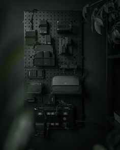 Men’s Black Bedroom Ideas, Camera Charging Station Ideas, Camera Battery Charging Station, Pegboard Camera Gear, Peg Board Charging Station, Camera Charging Station, Pegboard Charging Station, Film Gear Storage, Camera Organization Storage