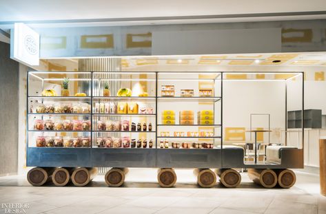 Integrated lighting accentuates the dimensions of the truck's frame, while highlighting the dried fruits on offer. Croatian House, Caprese Sandwich, Fruit Farm, Retail Space Design, Members Club, Food Retail, Cedar Log, Aluminum Chairs, Small Cafe