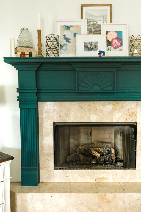 Green fireplace trim with art mantel decor in the living room/family room Light Green Fireplace, Green Mantel Fireplace, Colorful Fireplace Mantle, Maximalist Fireplace Mantle, Emerald Green Fireplace, Painted Fireplace Mantels Color, Green Fireplace Mantle, Green Painted Fireplace, Green Living Room Fireplace