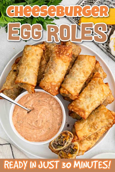 These amazing Cheeseburger Egg Rolls makes a hearty appetizer that everyone will love. These are a fun twist to a classic Egg Roll with a crispy texture and cheesy center. We love to serve with the made from scratch dipping sauce for even more flavor. The next time you need an impressive appetizer, make these egg rolls. #eatingonadime #cheeseburgereggrolls #easyappetizer Cheeseburger Egg Rolls Recipe, Egg Roll Dipping Sauce, Egg Roll Sauce, Hamburger With Egg, Hearty Appetizer, Bbq Egg, Cheeseburger Egg Rolls, Party Food Dips, Homemade Cheeseburgers