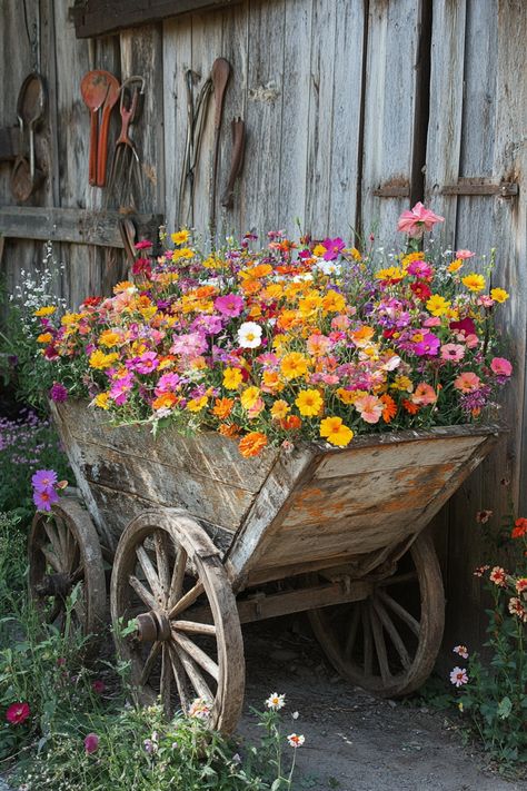 29 Tips for Combining Modern and Antique Styles Outdoors Yard Decor Ideas, Wrought Iron Bench, Vintage Cart, Wheelbarrows, Cascading Flowers, Iron Bench, Modern And Antique, Focal Points, Yard Decor