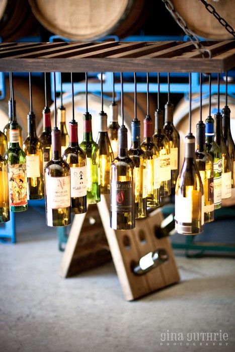 30 Wine Bottle Light Chandelier Hanging from Wood Rack 1 - Pendant Lighting - iD Lights Beer Bottle Chandelier, Riddling Rack, Wine Bottle Chandelier, Bottle Pendant Light, Chandelier Diy, Wine Bottle Light, Bottle Chandelier, Wood Rack, Bottle Pendant