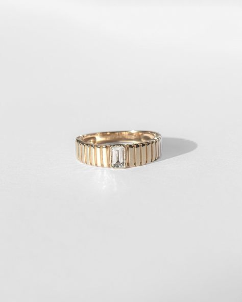 This stunning Venus ring features a 9K solid gold ribbed ring with a beautiful center emerald-cut white topaz stone. Tarnish-resistant, waterproof, and safe for sensitive skin. Venus Ring, Ribbed Ring, Rib Ring, Black And White Wedding Theme, Goddess Of Love, Vermeil Jewelry, Solid Gold Jewelry, Topaz Stone, Pearl Charms