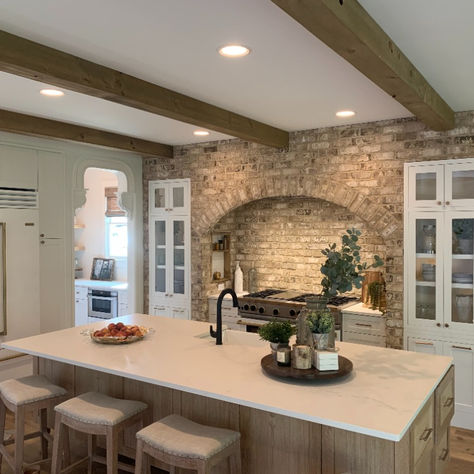 Alison and Mike chose to put brick in their kitchen and it made a statement. They used Rae's Creek from our Handcrafted Collection, which is a true tumbled brick. Brick Kitchen Range Hood, Hearth In Kitchen, Brick Around Stove In Kitchen, Brick Stove Surround Kitchen, Brick Archway In Kitchen, Brick In Kitchen, Farm Houseplans Interior, Farm Houseplans, Alison Victoria