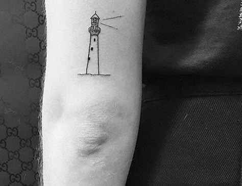 Lighthouse Tattoo Back Of Arm, Lighthouse Anchor Tattoo, Dainty Lighthouse Tattoo, Edinburgh Tattoo Ideas, Simple Lighthouse Tattoo, Minimalist Lighthouse Tattoo, 2025 Prayer, Madrid Tattoo, Lighthouse Tattoo