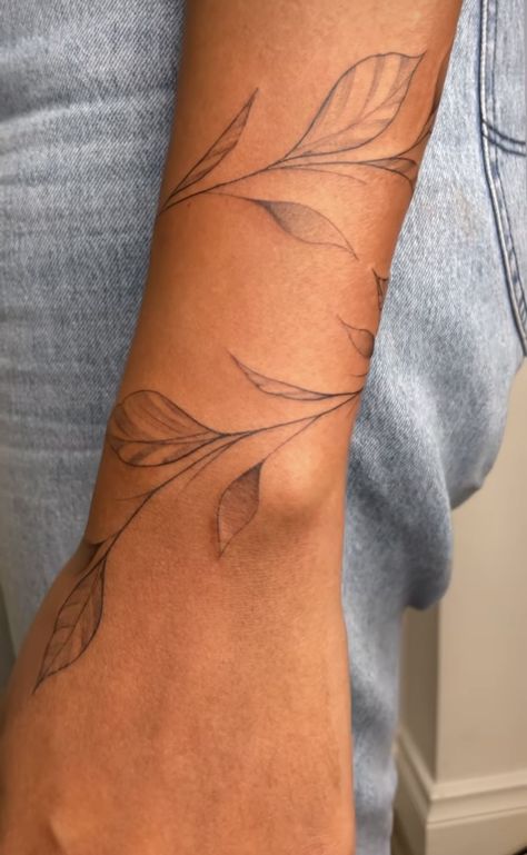 Fine Line Leaf Tattoo Arm, White Vine Tattoo, Vine Wrist Wrap Tattoos For Women, Vine With Words Tattoo, Wrist Leaves Tattoo, Leave Arm Tattoo, Wrap Forearm Tattoo Women, Vine Tattoo On Forearm, Leaves Around Wrist Tattoo