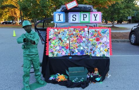 Trunk or Treat - I Spy Game... Just glue LOTS of little toy junk on the boards (puzzle pieces, kids meal toys, stickers, even broken ones!) Take a picture of each one as you glue it on. Then show 2 competitors a picture (we had them on the iPad). One who finds it first wins a prize! The kids LOVED it! Also, that is my son as a toy Army man. Toys Stickers, Fall Festival Games, Trunk Or Treat Ideas, Festival Games, Clever Halloween, I Spy Games, Kids Meal, Treat Ideas, Carnival Games