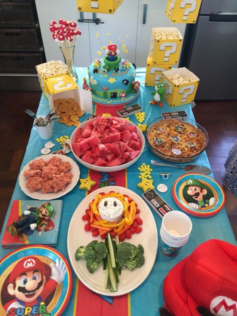 Mario And Luigi Birthday Party Table, Super Mario Bros Party Snacks, Super Mario Themed Dinner, Mario Bros Snack Ideas, Super Mario Bros Movie Night, Super Mario Pool Party Ideas, Mario Party Snack Ideas, Super Mario Sweet Table, Mario Bros Table Decorations