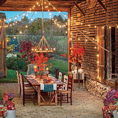 As the air turns crisp, take it outside for a setting that is sure to wow. A rustic barn makes the perfect dining room for a fall meal. Outdoor Living Wall, Living Pool, Party Barn, Outdoor Set, Catering Food, Outside Living, Fall Outdoor, Living Wall, Outdoor Dining Area