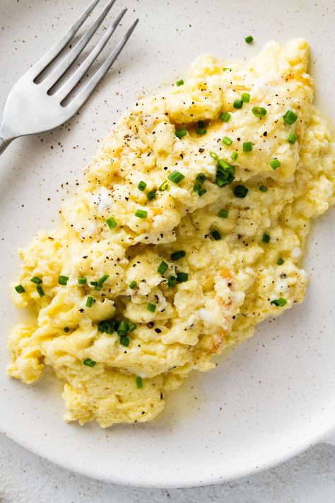 These cottage cheese scrambled eggs are a great way to switch up your morning breakfast! They're super easy to make and result in fluffy, creamy eggs that are high in protein. Cottage Cheese Scrambled Eggs, Cheese Scrambled Eggs, Light Foods, Blueberry Yogurt Muffins, Scrambled Eggs With Cheese, Cottage Cheese Eggs, Eating Bird Food, Creamy Eggs, Eggs Breakfast