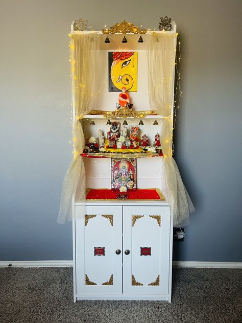 Instead of buying a traditional Mandir here in US(which could cost me an arm and a leg😩), I made my own Mandir with using an IKEA cabinet and some DIY hacks. Sharing glimpses of my work and my new mandir Diy Mandir Ideas Ikea, Pooja Mandir Cabinet, Pooja Mandir Diy Ikea Hacks Usa, Ikea Mandir Hack, Diy Puja Mandir Home, Diy Pooja Mandir Usa, Ikea Pooja Mandir, Mandir Diy Ideas, Diy Pooja Mandir Ikea Hacks