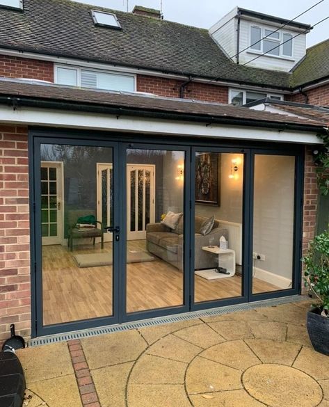 We supplied and installed these lovely bifold doors for a home in Surrey.⁠ ⁠ These doors are perfect in the Summer when you want to open up your home to the outdoors and enjoy the benefits of indoor / outdoor living. The traffic door allows for ultimate flexibility, particularly in the colder weather or for pets and children to easily use.⁠ ⁠ Our bifolds are a great choice for enjoying the summer sunshine in and outside your home - drop us a DM to find out more! Bifold Doors Extension, Bifold Doors Onto Patio, Bifold Door Ideas, Bi Folding Doors, Small Dining Space, Bifold Patio Doors, Bi Fold Doors, Quiet Morning, Roof Lantern