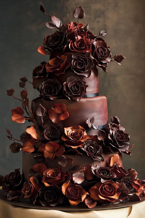 Wedding dessert display. Three-tiered cake adorned with sculpted chocolate roses and sugar-crafted cascading petals.

Your wedding cake is so much more than just a dessert. It's a centerpiece, a cherished tradition, and let's face it, a divine Instagram opportunity. Choosing the right floral arrangement to enhance your cake can elevate its aesthetic from nice to truly unforgettable. If you're pondering about the perfect bloom…

Read more: https://tastywed.com/generated-post-28-innovative-wedding-cake-flower-arrangement-ideas/ Small Chocolate Wedding Cake, Dark Academia Wedding Cake, Chocolate Wedding Cake Ideas, Brown Wedding Ideas, Wedding Dessert Display, Brown Wedding Cakes, Dark Academia Wedding, Wedding Cake Chocolate, Chocolate Brown Wedding