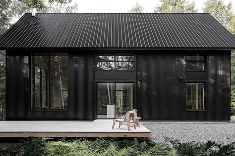 This All-Black Cottage Will Have You Pining To Live In The Forest - UltraLinx Scandinavian Exterior, Scandinavian Exterior Design, Black Cladding, Black Cottage, Black Houses, Casa Exterior, Black Windows, Black House Exterior, Metal Building Homes