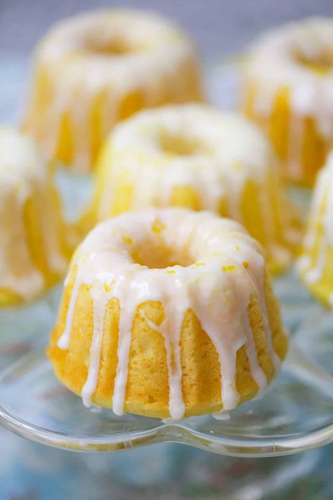 Mini Lemon Bundt Cakes are homemade mini bundt cakes bursting with citrusy, lemon flavor, glazed with a fresh lemon zest icing for Spring! Mini Lemon Bundt Cakes, Mini Bundt Cakes Recipes, Lemon Bundt Cake Recipe, Mini Bundt, Lemon Bundt Cake, Eggless Recipes, Mini Bundt Cakes, Lemon Dessert Recipes, Mini Treats