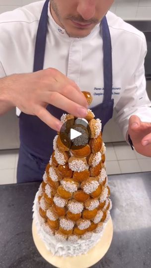 64K views · 6.8K reactions | Croquembouche Vanille et Noisettes 🥰 
 
Choux craquants gourmands 😉

Reposted from @pierrejean_quinonero

#choux #love #patsry #food #vanille #savoirfairefrancais #foodporn #luxe #viralreels #instagood #chefpatissier | Pastry fresh faces | 2 Chainz · Presha Croquenbuche Christmas, Croque En Bouche Wedding, Croquembouche Christmas, Croquembouche Tower, Choux Au Craquelin Photography, French Wedding Cake Croquembouche, 2 Chainz, Fresh Face, Pastry