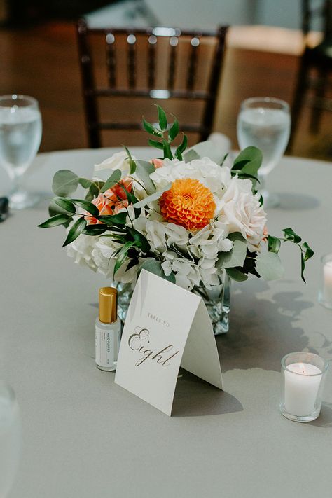 Small White & Orange Floral Arrangement Centerpiece for Wedding Reception Orange Green And White Floral Arrangements, Yellow White Orange Flower Arrangements, Orange Yellow White Centerpiece, White And Orange Floral Arrangements, Orange And White Floral Centerpiece, Orange White Wedding Flowers, Orange And Green Floral Arrangements, Orange White And Green Wedding Flowers, Orange And White Flower Arrangements