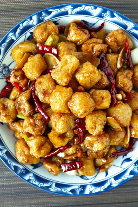 Made with crisp on the outside and spongy on the inside fried tofu puffs, this Kung Pao Tofu Puffs stir-fry is full of savory, spicy, and numbing flavors with a hint of sweetness and tang! It’s quick and easy to make in under 30 minutes and SO GOOD with steamed rice! #kungpaotofu #tofu #kungpao #vegetarian #vegan #dinner #stirfry #sichuanfood #asianfood #spicy #betterthantakeout | That Spicy Chick