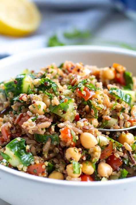 This colourful and delicious Quinoa and Brown Rice Salad is a wholesome twist on a classic tabbouleh recipe. Packed with protein-rich quinoa & brown rice, chickpeas, veggies & fresh herbs, it's a delicious vegan & gluten-free side dish bursting with Mediterranean flavours! quinoa salad | brown rice salad | mediterranean dishes | gluten free | vegan recipes Quinoa And Brown Rice Recipes, Brown Rice And Quinoa Recipe, Quinoa And Brown Rice, Wild Rice Salad Recipe, Brown Rice And Quinoa, Salad Mediterranean, Rice And Quinoa, Healthy Food Recipies, Tabbouleh Recipe