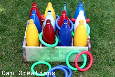 ring toss. spray paint the inside of the bottles. Let dry for 24 hours. weight by filling with sand. Bottle Toss Game, Diy Ring Toss, Carnival Party Games, Diy Carnival Games, Homemade Carnival Games, Carnival Games For Kids, Diy Party Games, Kids Ring, Diy Carnival