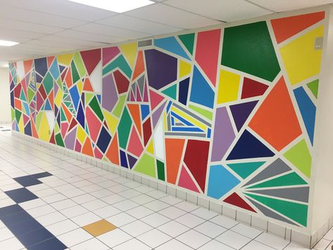 Painted geometric wall mural in an elementary school. Took 3 days and we used Valspar paint with painters tape. The kids and staff love it! Painting Ideas For School, Mural School, Easy Wall Painting Ideas, Easy Wall Painting, School Wall Art Ideas, Wall Painting Ideas, School Wall Art, School Murals, School Painting