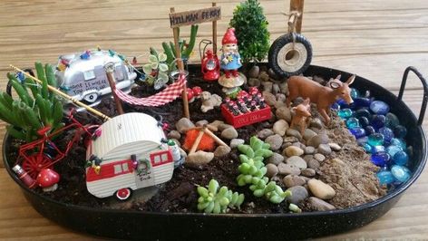 My fairy garden dedicated to my favorite campground Hillman Ferry at Land between the Lakes. | Indoor fairy gardens, Fairy garden designs, Fairy garden furniture Fairy Garden Design Ideas, Photo Setting, Beach Fairy Garden, Colored Furniture, Indoor Fairy Gardens, Setting Table, Fairy Garden Furniture, Summer Fairy, Fairy Garden Designs