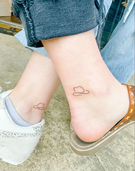 Cowboy hat, ankle, simple tattoo, small tattoo, best friend Small Cowboy Hat Tattoos, Cowboy Hat And Boots Tattoo Matching, One Line Cowboy Hat Tattoo, Cute Nashville Tattoos, Small Cowboy Hat Tattoos For Women, Nashville Friend Tattoos, Ankle Friendship Tattoos, Small Nashville Tattoo, Simple Nashville Tattoo